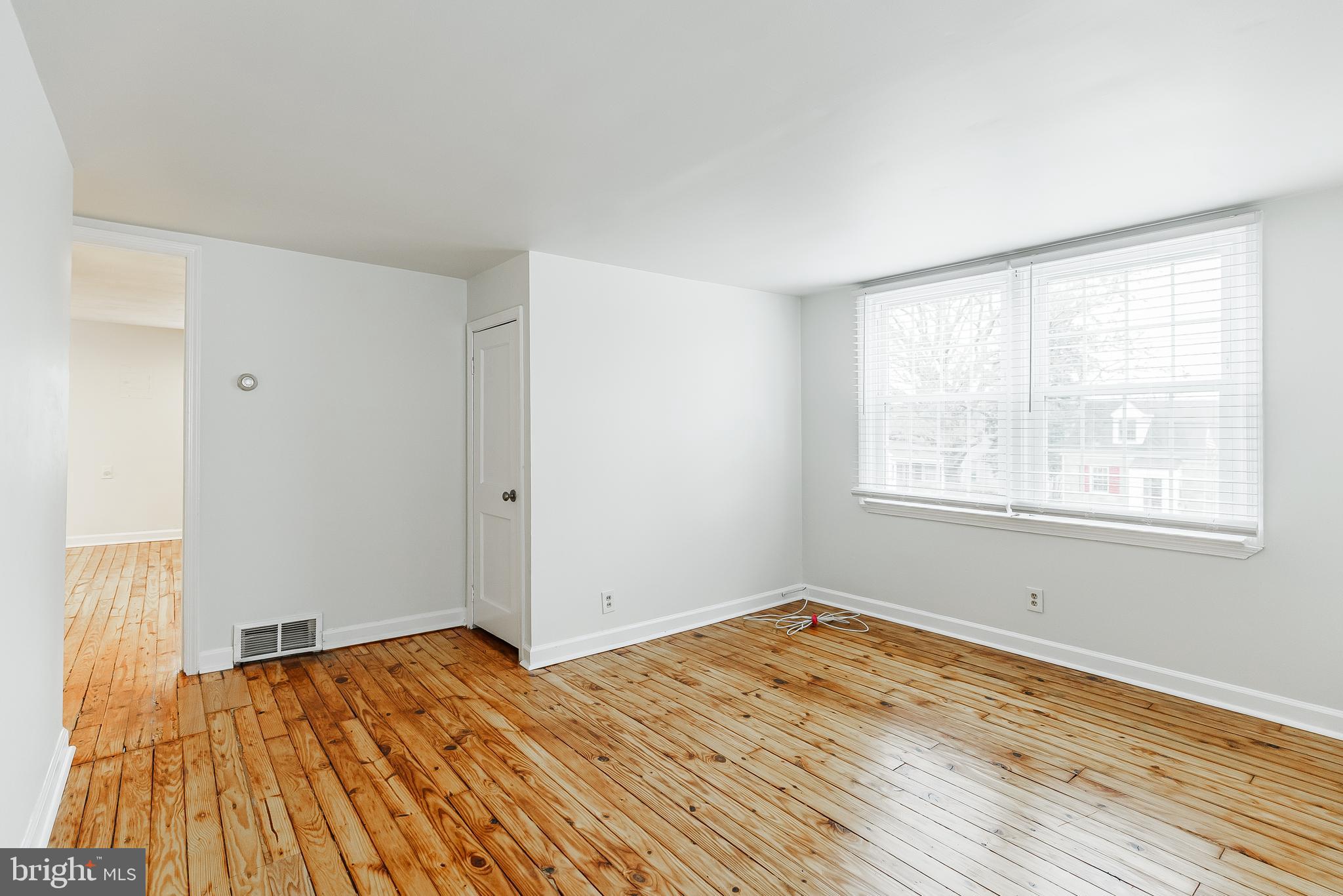 431 Central Avenue Glenside, PA 19038 - Photo 9 of 15 a view of empty room with wooden floor and fan