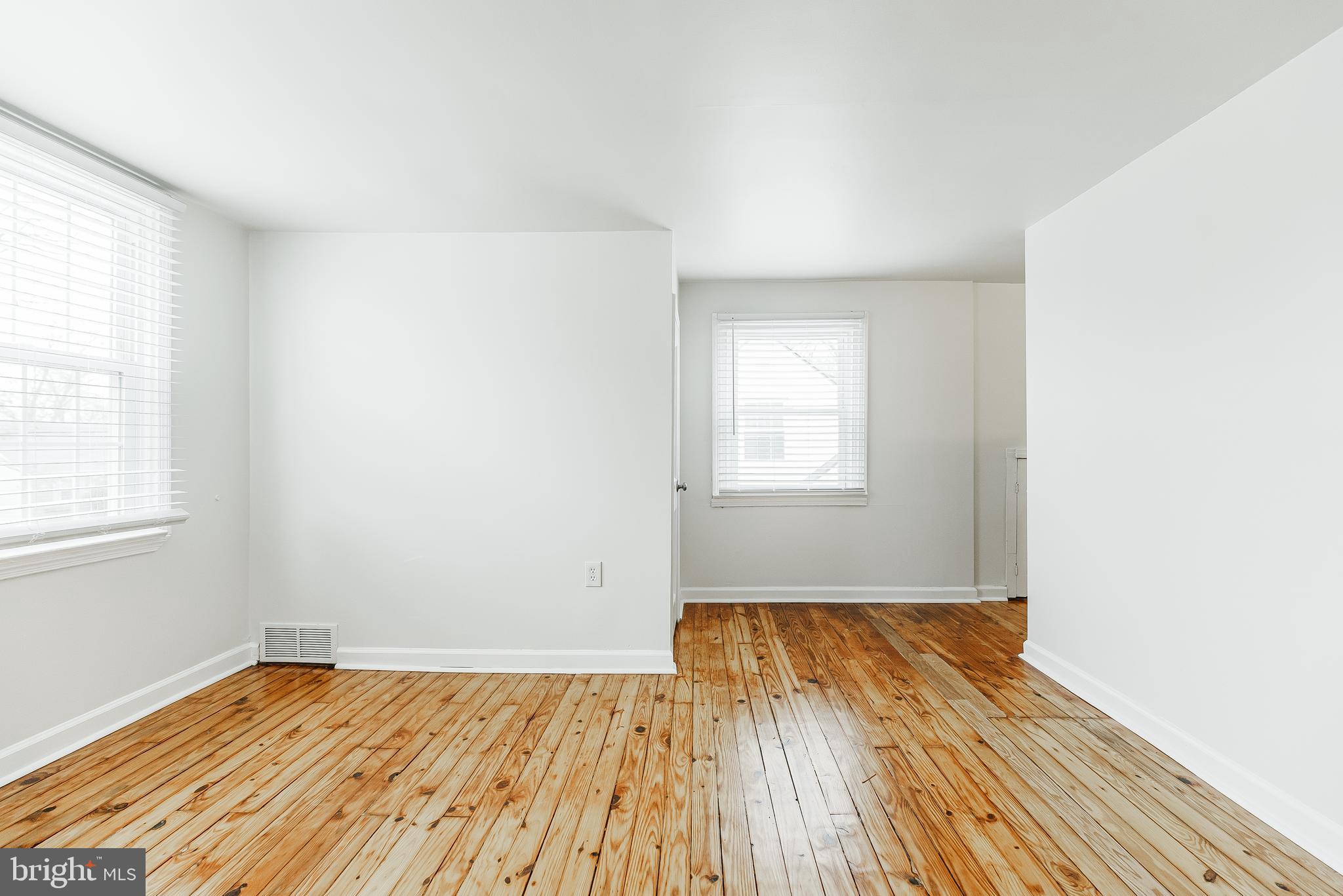 431 Central Avenue Glenside, PA 19038 - Photo 10 of 15 an empty room with wooden floor and windows