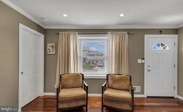 a view of room with furniture and wooden floor