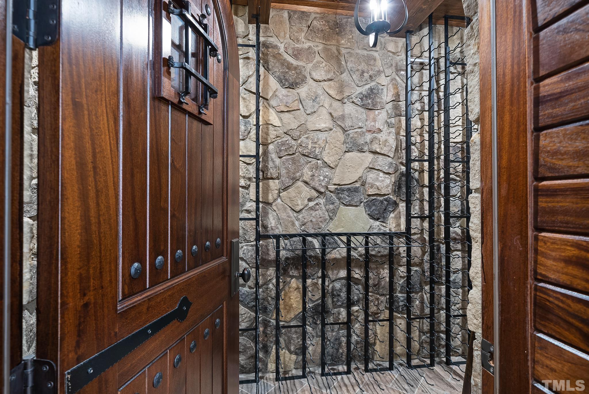 6009 Over Hadden Court Raleigh, NC 27614 - Photo 41 of 54 Daylight basement with separate exterior entrance would be perfect for In-law/nanny/teen suite. With Gas stone fireplace, built-in shelving flanking fireplace, full bath.