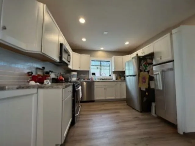 a bedroom with a bed and a cabinets