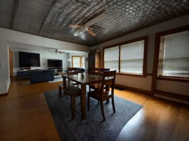 a view of a dining room with furniture window and wooden floor