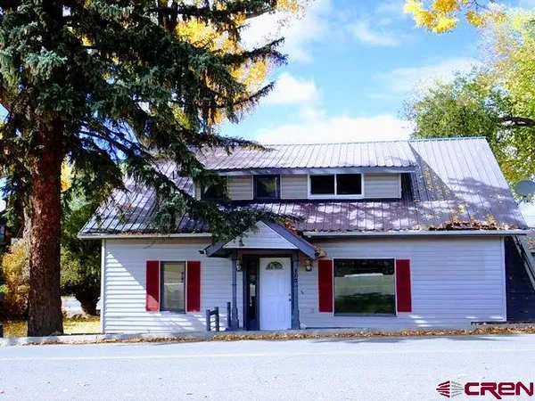 a front view of a house with yard
