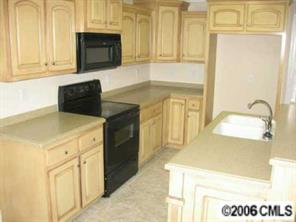 3614 Haigler Road Monroe, NC 28110 - Photo 4 of 7 a kitchen with granite countertop a sink and a stove top oven
