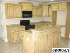 3614 Haigler Road Monroe, NC 28110 - Photo 5 of 7 a kitchen with stainless steel appliances granite countertop a stove and a microwave