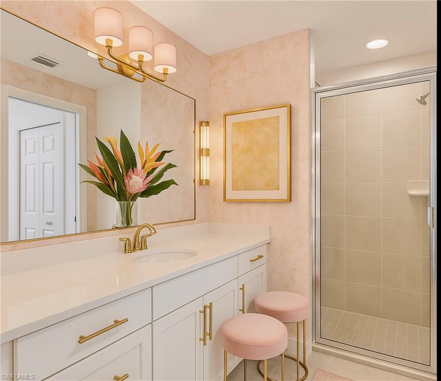 43981 Boardwalk Loop, Unit 2225 Punta Gorda, FL 33982 - Photo 11 of 48 a bathroom with a sink a toilet and a mirror