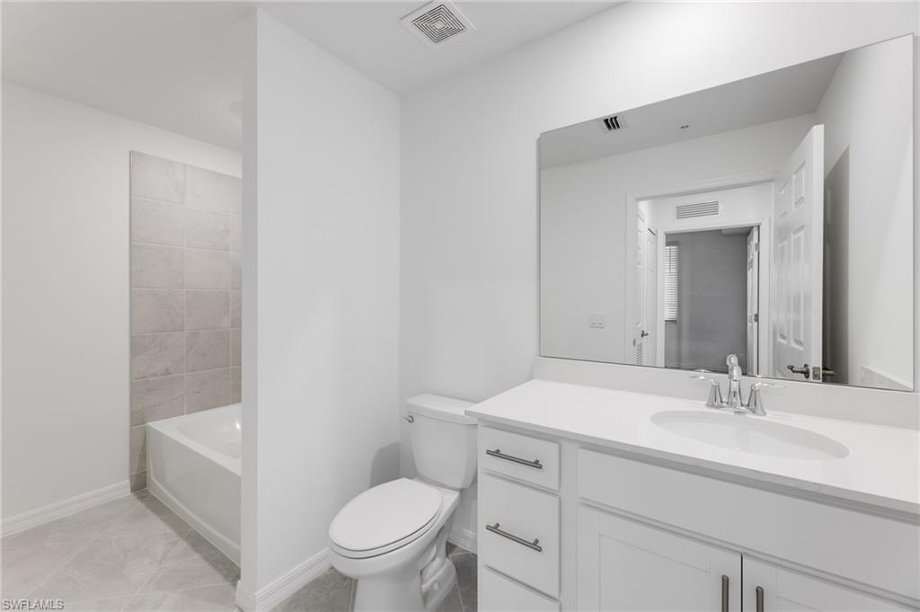 43981 Boardwalk Loop, Unit 2225 Punta Gorda, FL 33982 - Photo 16 of 48 a bathroom with a sink toilet vanity and tub