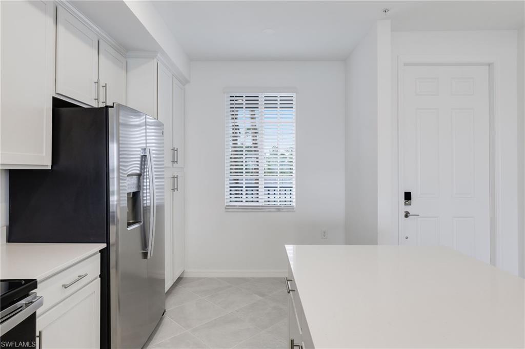 43981 Boardwalk Loop, Unit 2225 Punta Gorda, FL 33982 - Photo 19 of 48 a room with a refrigerator and a window