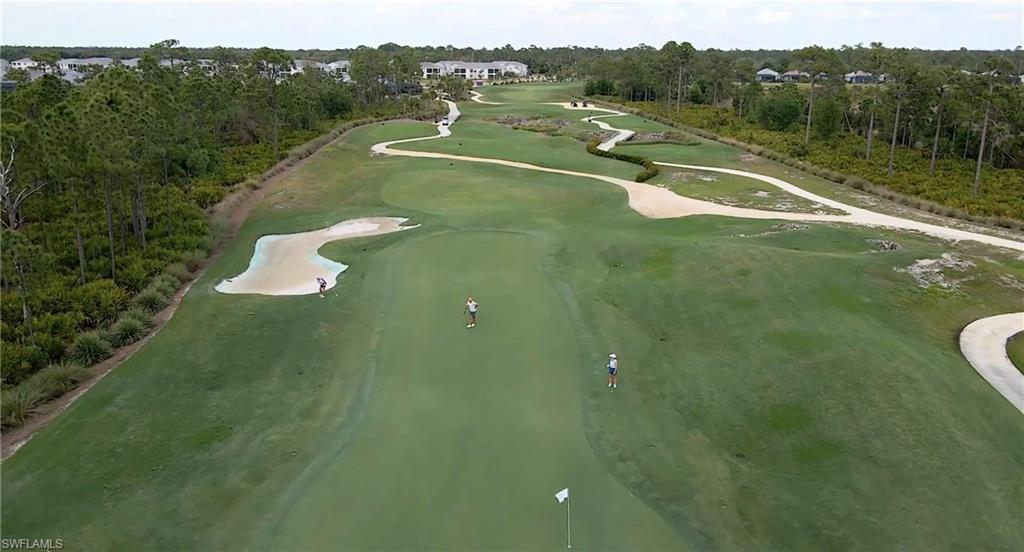 43981 Boardwalk Loop, Unit 2225 Punta Gorda, FL 33982 - Photo 28 of 48 a view of a water pond with green yard