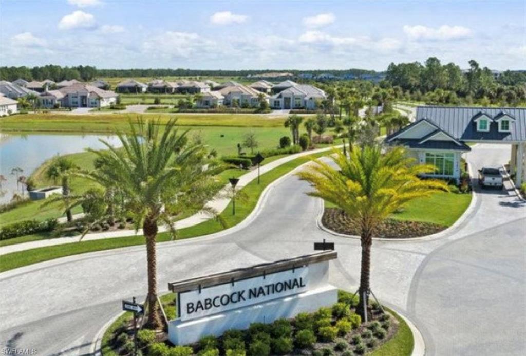 43981 Boardwalk Loop, Unit 2225 Punta Gorda, FL 33982 - Photo 37 of 48 a view of a swimming pool with a table and chairs