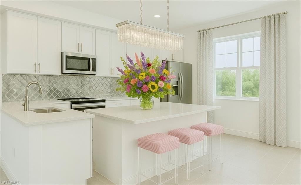 43981 Boardwalk Loop, Unit 2225 Punta Gorda, FL 33982 - Photo 7 of 48 a bathroom with a sink a faucet and a mirror
