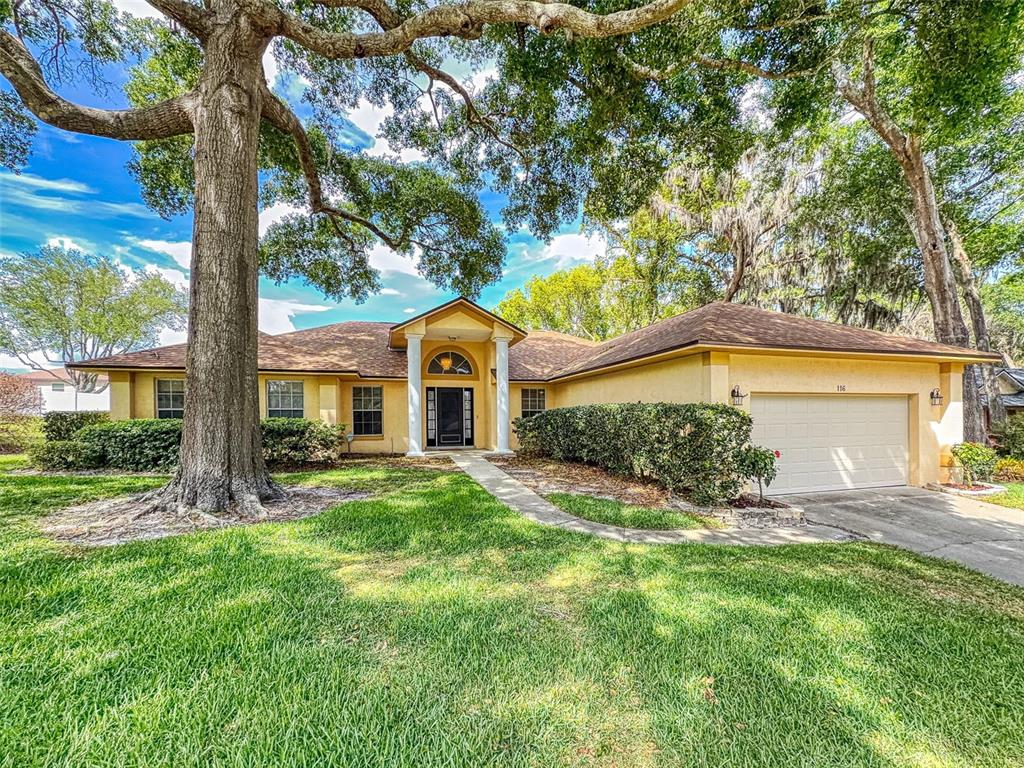 116 Wood Ridge Trail Sanford, FL 32771 - Photo 1 of 49 a front view of a house with a yard
