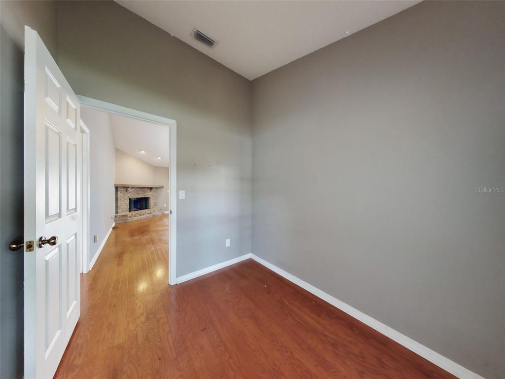 116 Wood Ridge Trail Sanford, FL 32771 - Photo 21 of 49 a view of a room with wooden floor and a window