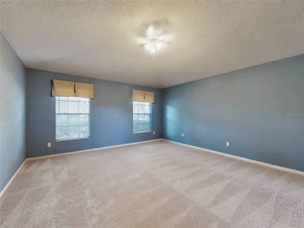 116 Wood Ridge Trail Sanford, FL 32771 - Photo 23 of 49 a view of a big room with windows and chandelier fan