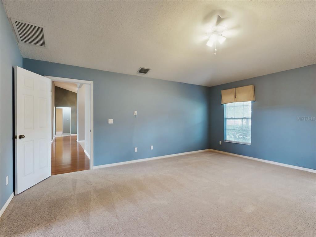 116 Wood Ridge Trail Sanford, FL 32771 - Photo 24 of 49 a view of a big room with windows and chandelier fan