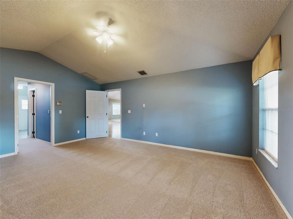 116 Wood Ridge Trail Sanford, FL 32771 - Photo 26 of 49 a view of a big room with windows and chandelier fan