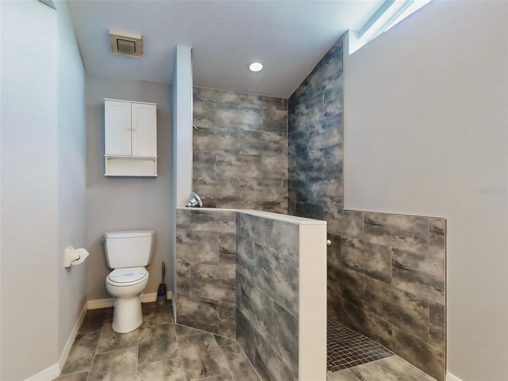 116 Wood Ridge Trail Sanford, FL 32771 - Photo 33 of 49 a bathroom with a toilet and a shower
