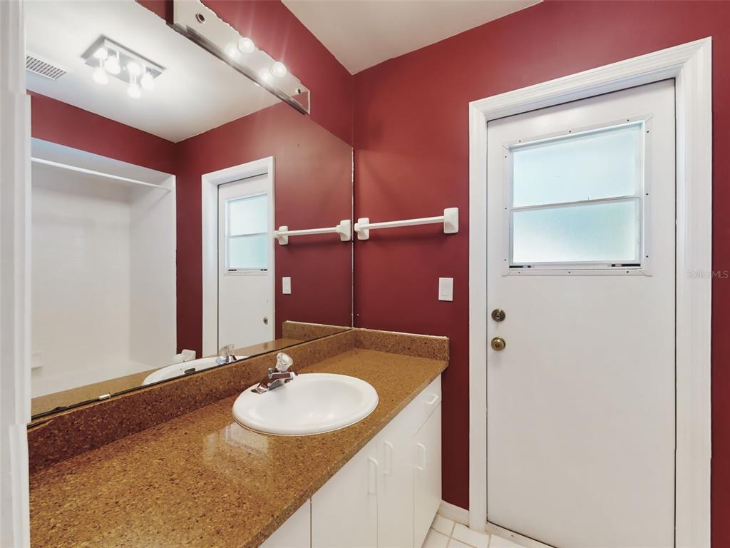 116 Wood Ridge Trail Sanford, FL 32771 - Photo 38 of 49 a bathroom with a sink and a mirror