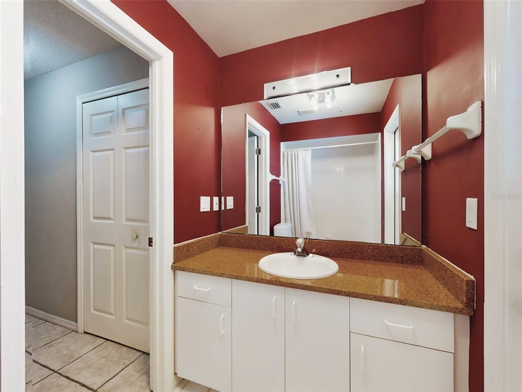 116 Wood Ridge Trail Sanford, FL 32771 - Photo 39 of 49 a bathroom with a sink vanity and a mirror