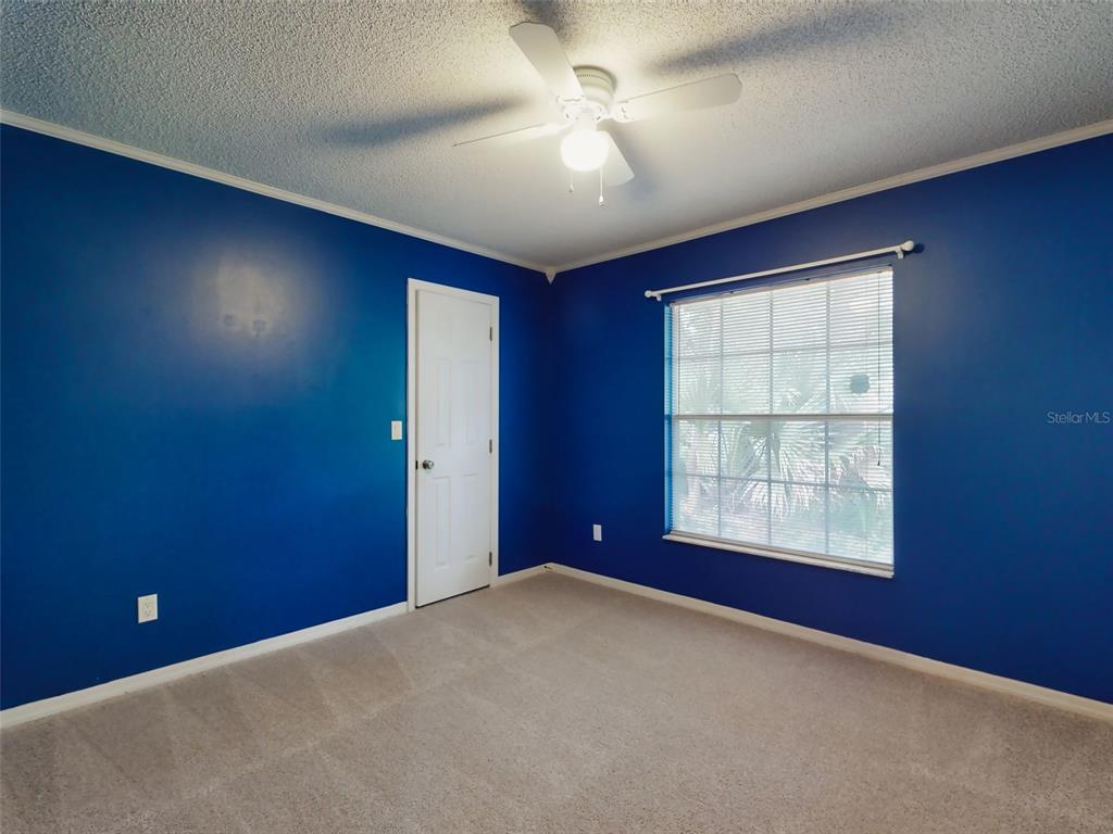 116 Wood Ridge Trail Sanford, FL 32771 - Photo 41 of 49 an empty room with windows and fan