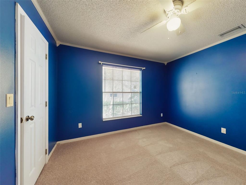 116 Wood Ridge Trail Sanford, FL 32771 - Photo 43 of 49 an empty room with windows and fan