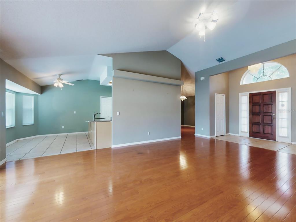 116 Wood Ridge Trail Sanford, FL 32771 - Photo 9 of 49 a view of a hallway with wooden floor