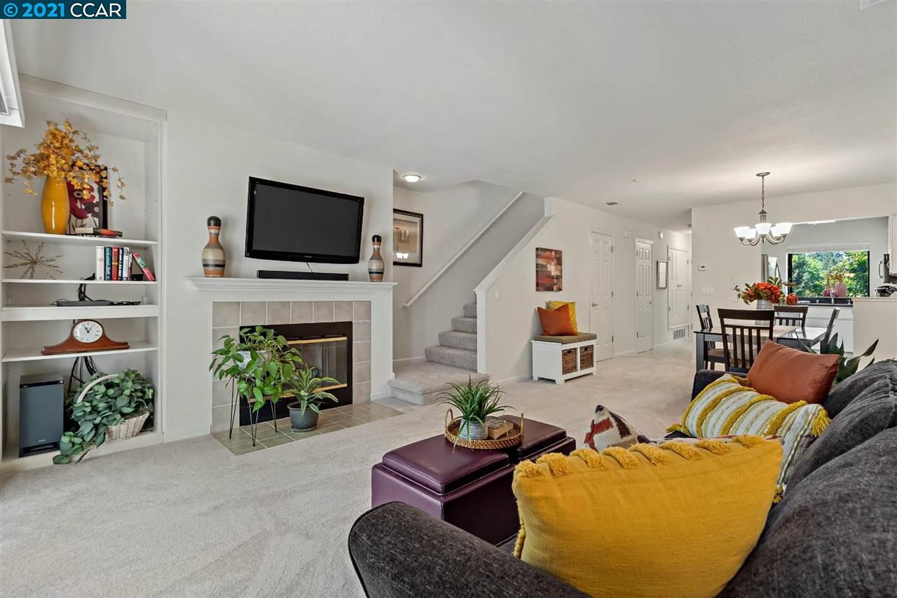 2590 Oak Road, Unit 249 Walnut Creek, CA 94597 - Photo 1 of 1 a living room with furniture a fireplace and a flat screen tv