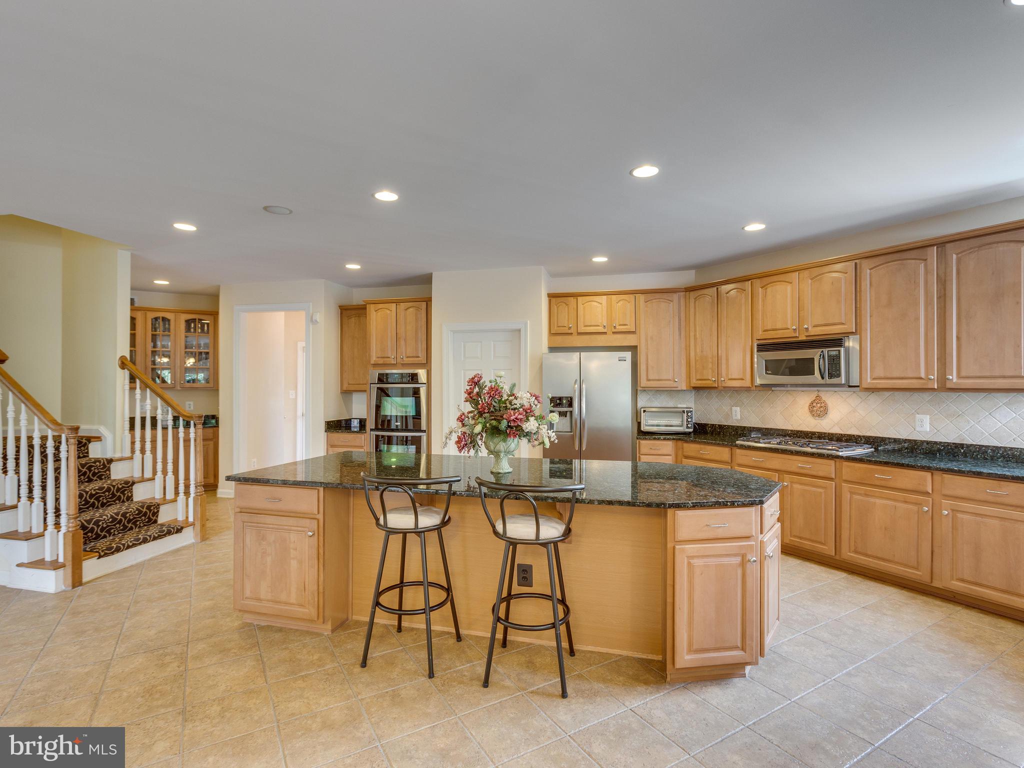 42294 Iron Bit Place Chantilly, VA 20152 - Photo 15 of 55 Second set of steps comes into the kitchen.
