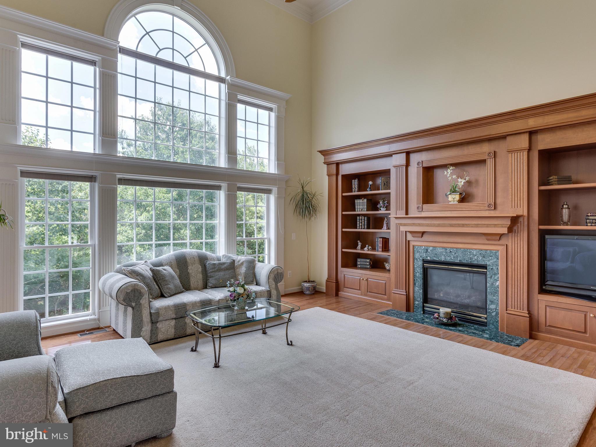 42294 Iron Bit Place Chantilly, VA 20152 - Photo 20 of 55 Crafted wooden bookcase and gas fireplace