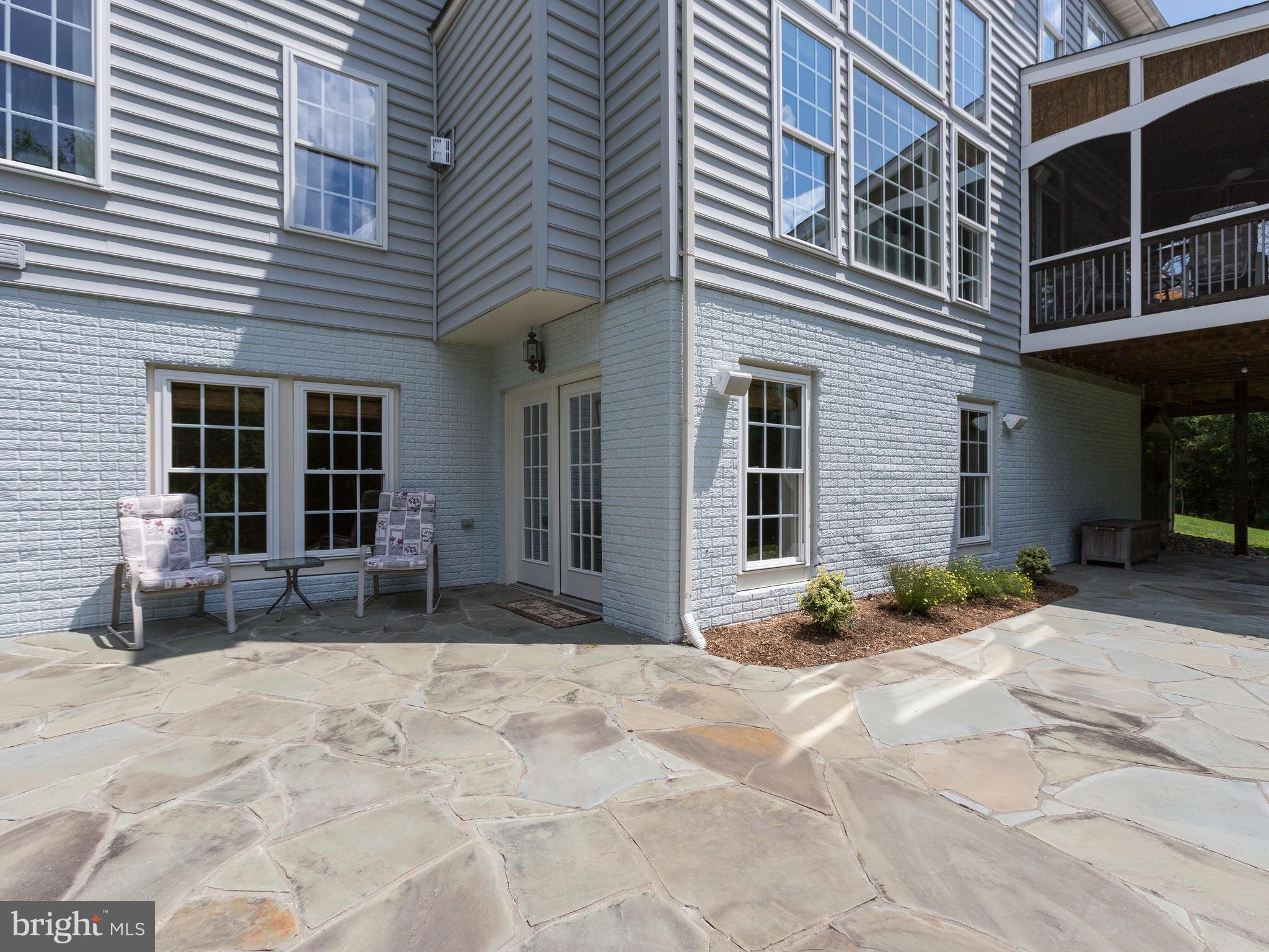 42294 Iron Bit Place Chantilly, VA 20152 - Photo 51 of 55 Walk out of the basement to the large stone patio.