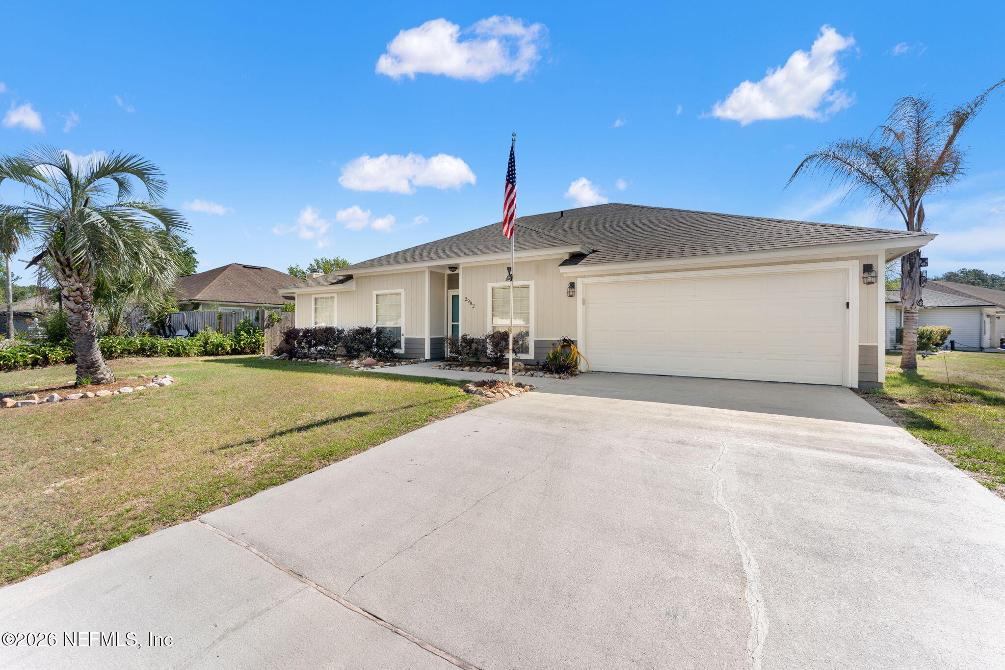 2982 Chief Ridaught Trail Middleburg, FL 32068 - Photo 4 of 29 a view of a white house with a yard in front of it