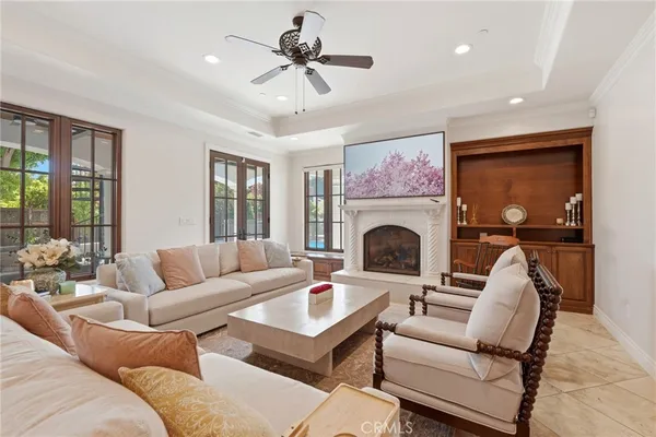 a living room with furniture ceiling fan and a rug