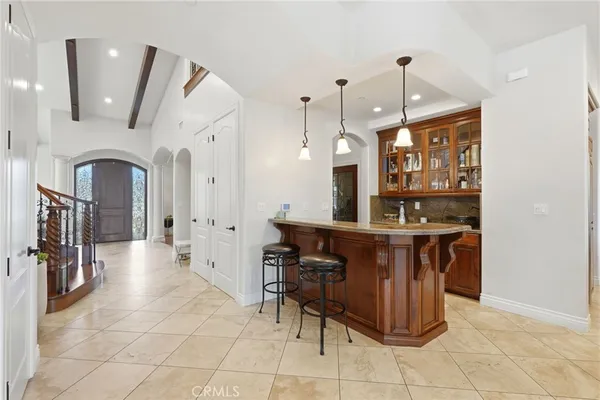 a kitchen with stainless steel appliances granite countertop a refrigerator and cabinets