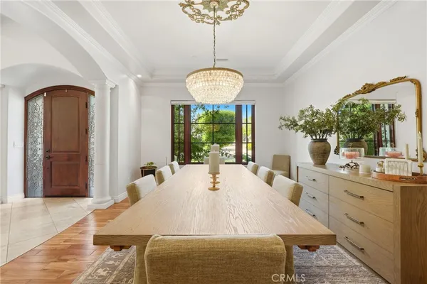 a kitchen with kitchen island granite countertop a sink and a large window