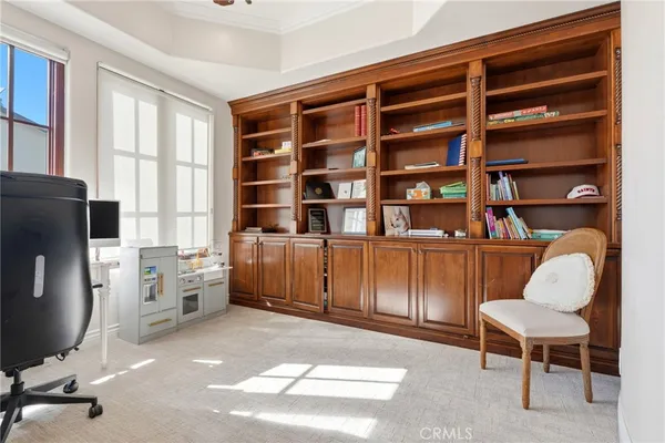 a bedroom with a bed and a fireplace