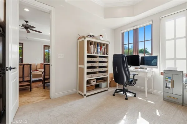 a bedroom with a large bed and a large window