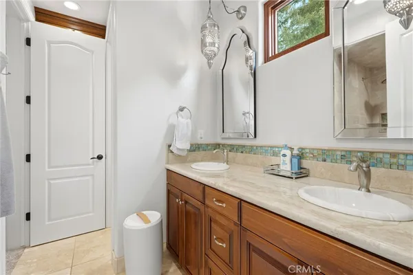 a view of a patio with a table and chairs