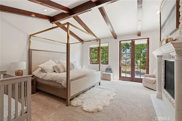 a view of a white building with a clock on the side of it