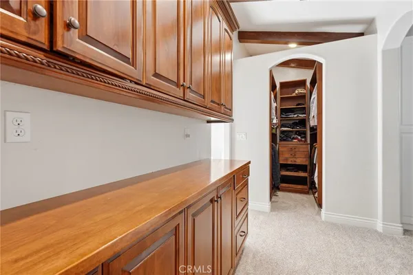 a view of a white house with a swimming pool