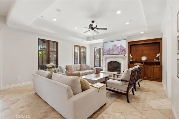 a living room with furniture fireplace and flat screen tv