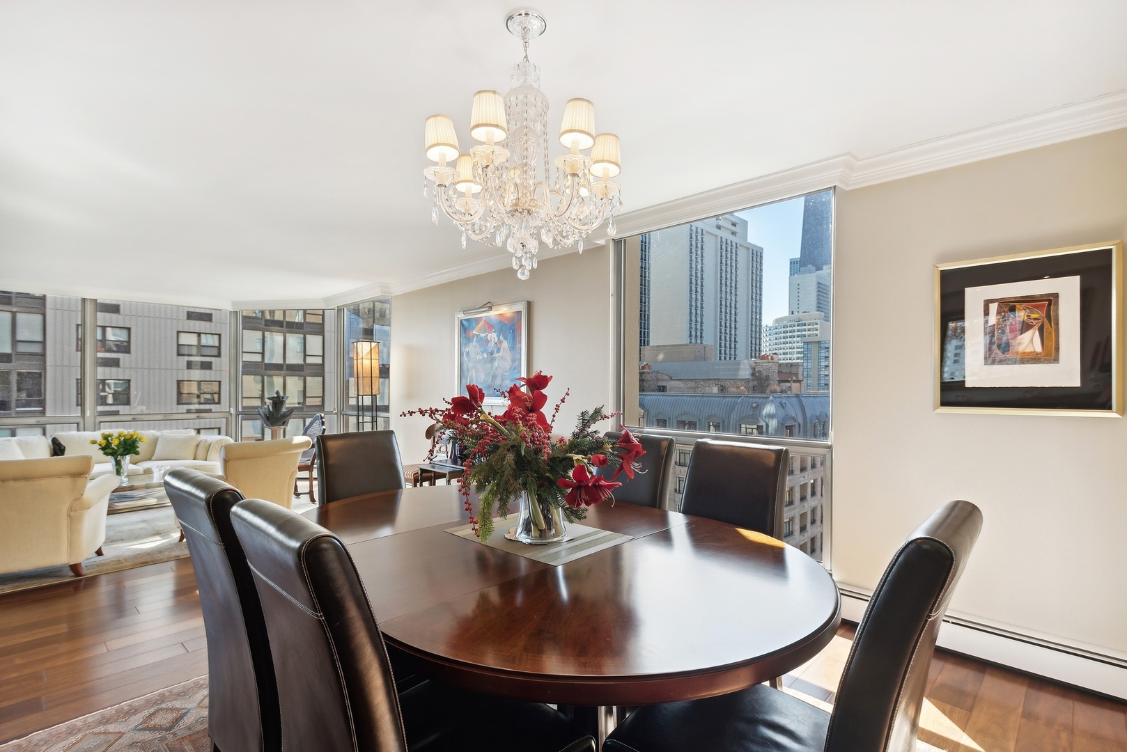 1310 North Ritchie Court, Unit 12BC Chicago, IL 60610 - Photo 11 of 38 a view of a dining room with furniture window and wooden floor