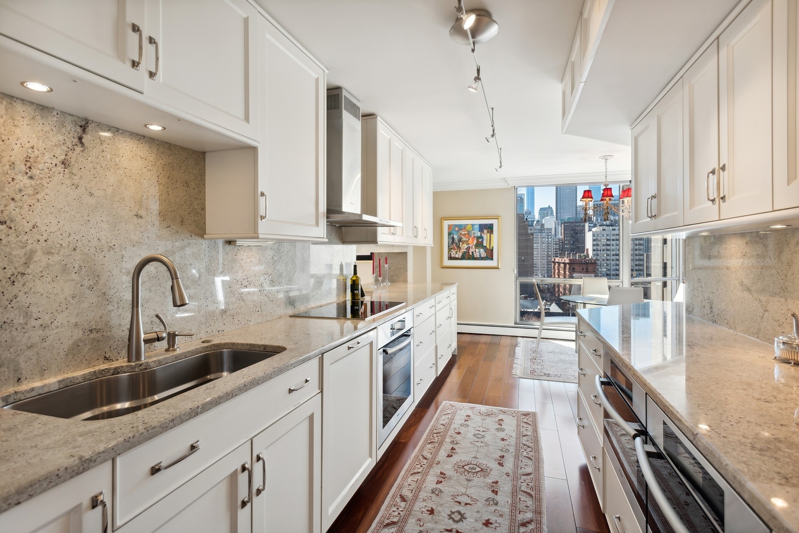 1310 North Ritchie Court, Unit 12BC Chicago, IL 60610 - Photo 12 of 38 a large kitchen with stainless steel appliances lots of counter space sink and cabinets