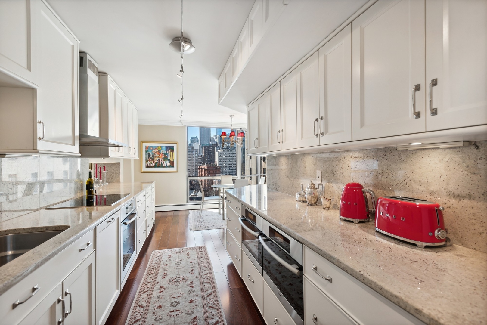 1310 North Ritchie Court, Unit 12BC Chicago, IL 60610 - Photo 13 of 38 a kitchen with granite countertop a sink dishwasher stove and cabinets
