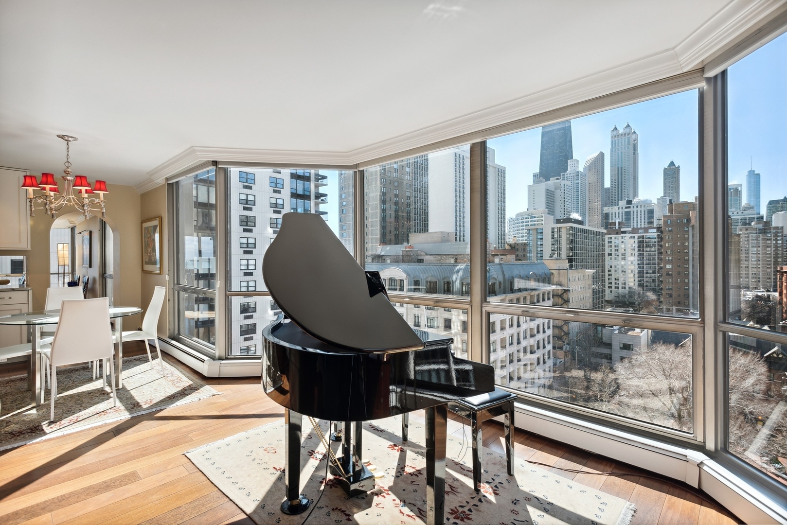 1310 North Ritchie Court, Unit 12BC Chicago, IL 60610 - Photo 18 of 38 a living room with furniture and a floor to ceiling window