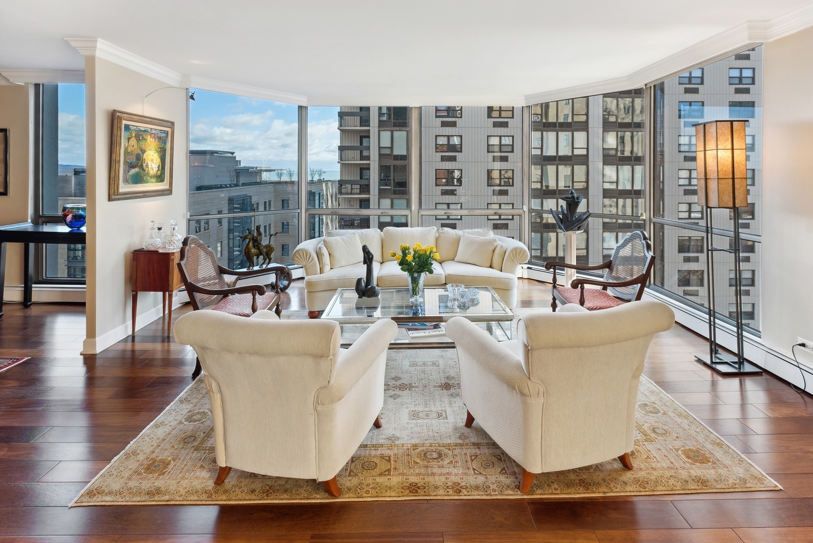 1310 North Ritchie Court, Unit 12BC Chicago, IL 60610 - Photo 2 of 38 a living room with furniture and large windows