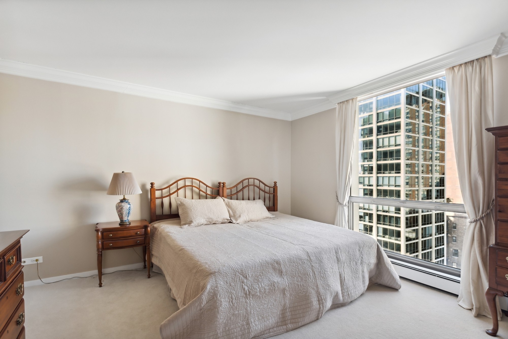 1310 North Ritchie Court, Unit 12BC Chicago, IL 60610 - Photo 25 of 38 a bedroom with a bed and a window