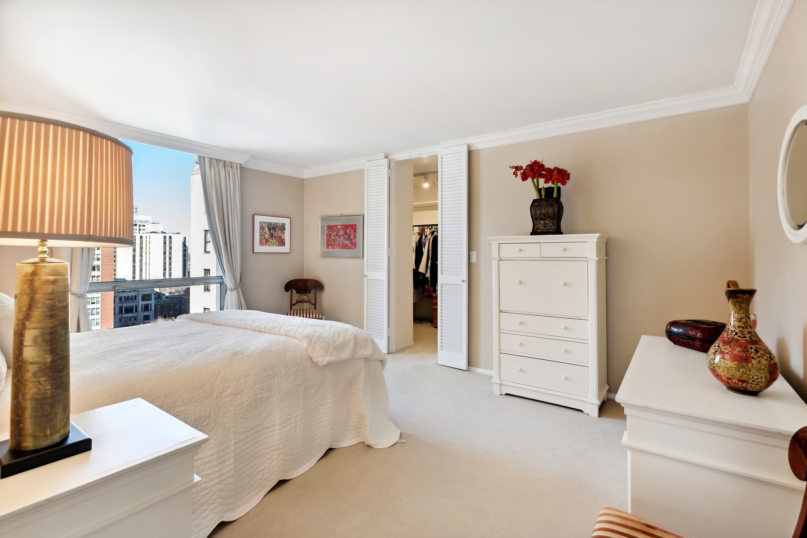1310 North Ritchie Court, Unit 12BC Chicago, IL 60610 - Photo 28 of 38 a bed room with a bed and a window