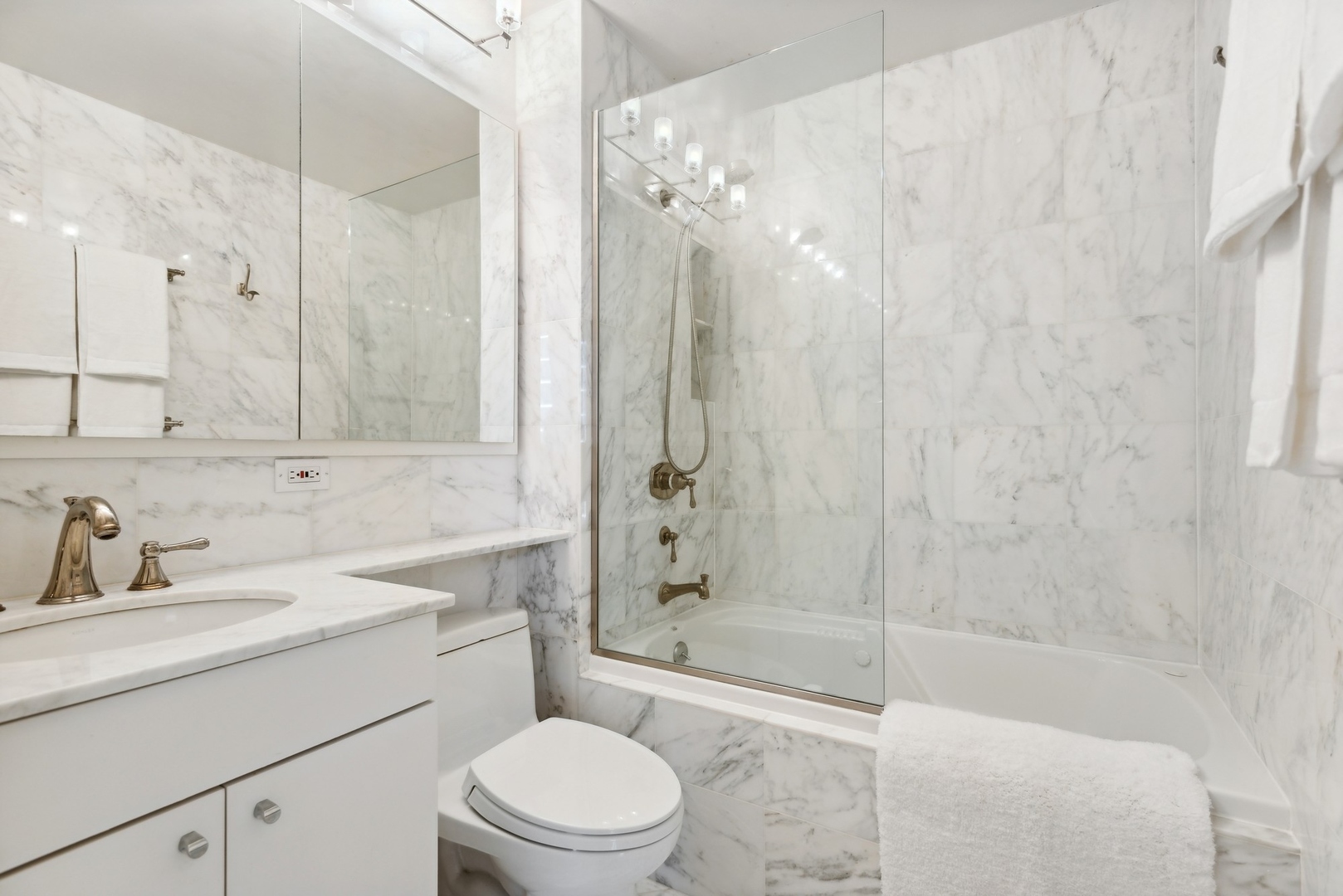 1310 North Ritchie Court, Unit 12BC Chicago, IL 60610 - Photo 29 of 38 a bathroom with a sink a toilet and shower