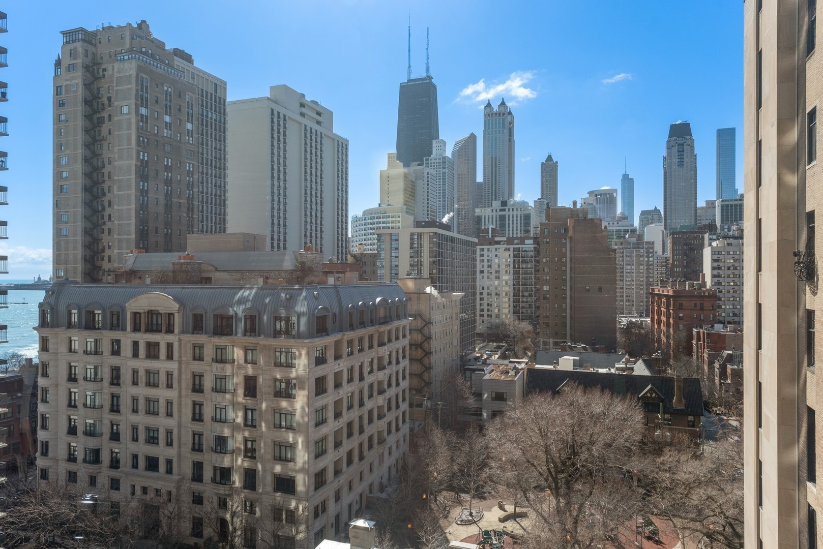 1310 North Ritchie Court, Unit 12BC Chicago, IL 60610 - Photo 31 of 38 a view of a city with tall buildings