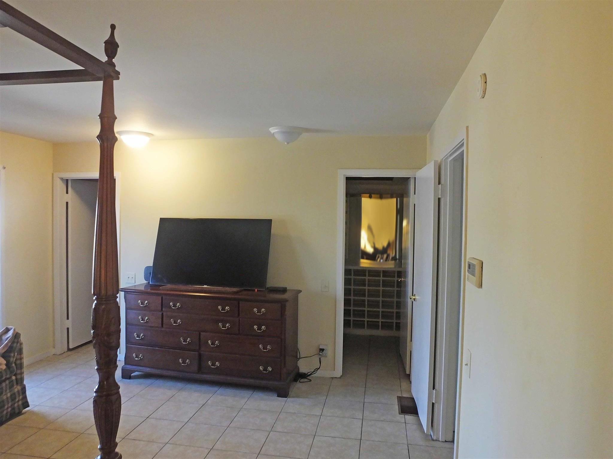 9575 Goose Branch Road Bon Aqua, TN 37025 - Photo 14 of 28 Master Bedroom has his and hers closets